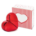 Parfum rechargeable en forme de coeur rouge présenté dans un sachet avec un autocollant phrase de remerciement
