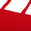 Culotte polaire rouge dans un sac assorti à longue poignée avec étiquette personnalisée et autocollant de Noël