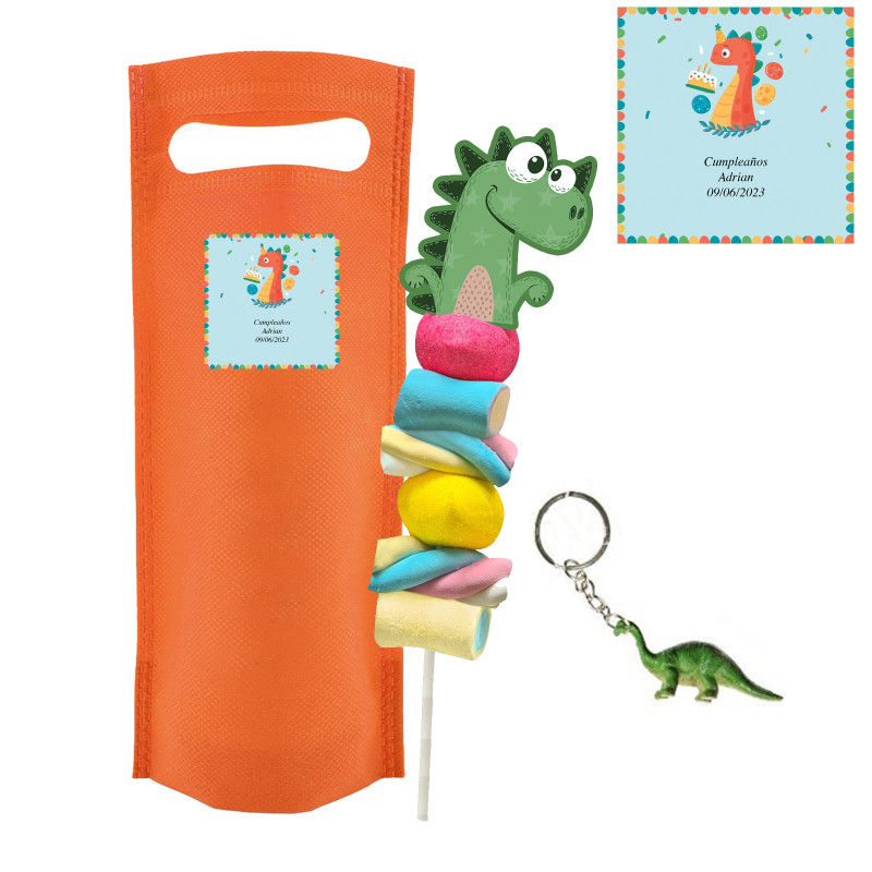 Brochette de bonbons dinosaure et porte-clés assorti dans un sachet orange avec autocollant d'anniversaire personnalisable